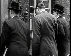 Backs: The Backs of Three Male British Cabinet Ministers