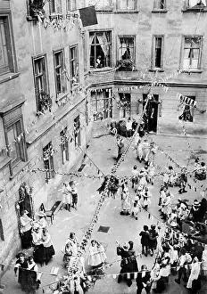 Slowly: Backyard party in a Berlin working-class district, 1926