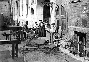 Tenement: Bag sewing in a backyard in Berlin, 1929