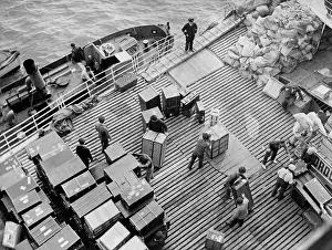 Cherbourg: Baggage and mail bags on a ship, 1934