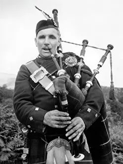 Bagpiper: Bagpiper in the Trossachs, Scotland