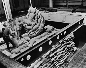 Stevedores: Bags of flour are loaded for shipment to ?