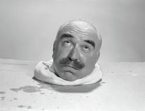 Sauna: Bald elderly man head sweating in steam box