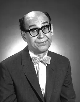 Bald Man with Glasses and In Bow Tie Making a Funny Face