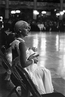 Jeanette Jones: Ballroom dancer sitting at side of dance floor