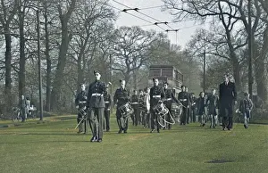John Maclellan: Band of musicians marching along a road