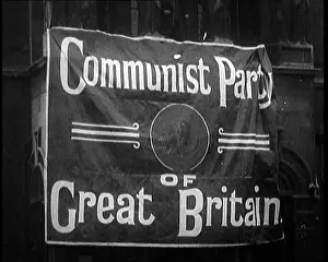 Strung: Banner Strung Across A Building Reads Communist