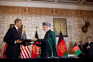 Foreign Policy: Barack Obama and Hamid Karzai exchange documents