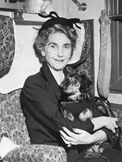 Basset: Barbara Hutton leaves Paris by train on her journey
