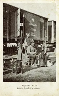 Shaves: Barber at the trackside - Harbin, China