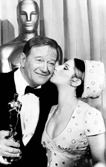 Grit: Barbra Streisand (right), John Wayne (left), ?