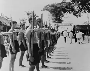 Lcgr1411: Barefoot villagers perform training drills using
