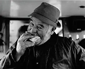 Raindrops: Bargeman eating a sandwich