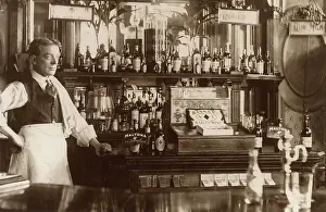 Capstan: Barman standing by well-stocked bar