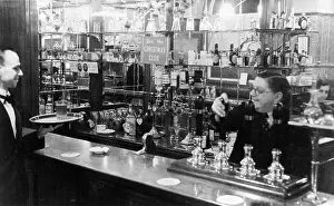 Barman: Barman and waiter working in a bar