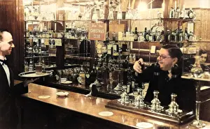 Barman: Barman and waiter working in a bar