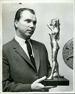 Selects: Baron Joseph Dobronyi, sculptor, with Bardot statuette