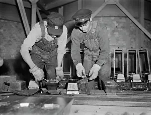 Molding: Bars of pure tin are trimmed and cleaned before