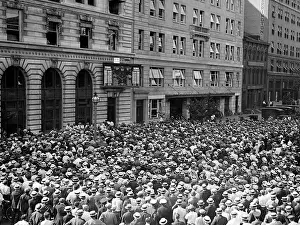 Scoreboard: Baseball. A crowd watches the score board ?