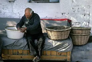 Skilled: Basket maker, at work outside his house in Thassos, Greece