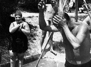 Showering: Some bathers are taking a shower