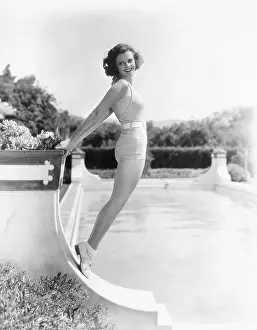 Leggy: Bathing beauty posing by the pool