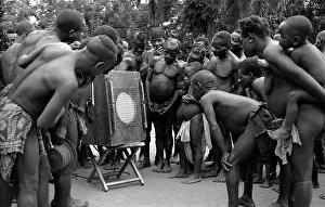 Loudspeakers: Batwa pigmies listening to playback