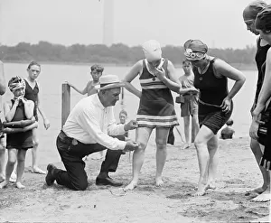 Hemlines: A beach official checks the amount of thigh ?