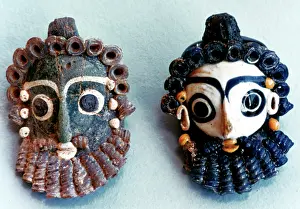 Phoenician: Bearded head, pendants, worn as protective amulets