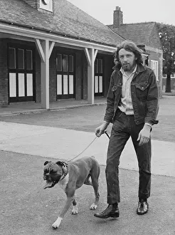 Walkies: Bearded man with boxer dog