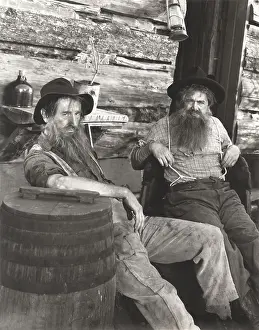 Lounging: Two bearded men lounging