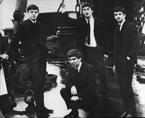 Earning: The Beatles on the deck of a Jersey ferry