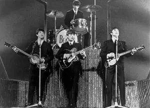 Commercially: The Beatles performing in a concert