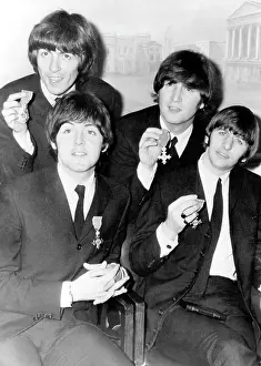 Commercially: The Beatles pop group with their MBEs