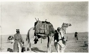 Sepia Images: Two Bedouin men with a camel, Middle East