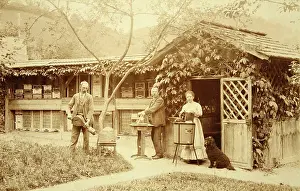 Hives: Three beekeepers in front of their garden