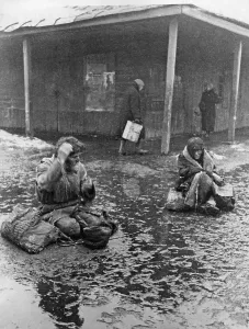 Impoverished: Begging farmers in the rain, 1929