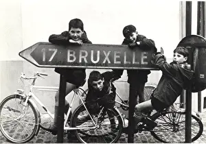 Kilometres: Belgian boy scouts with road sign