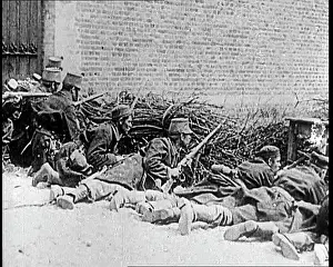 Ducking: Belgian Soldiers Ducking Behind A Low Barricade