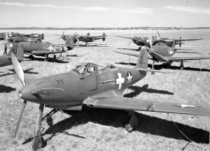 Respectively: Bell P-39D Airacobras and Lockheed P-38E Lightnings