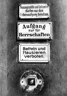 Prohibited: Bell and signs on a front door in Berlin, around 1900