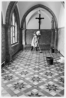 Cecilias: Benedictine nun cleaning tiled floor, St Cecilia's Abbey