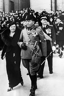 Signora: Benito Mussolini (center), after attending ?