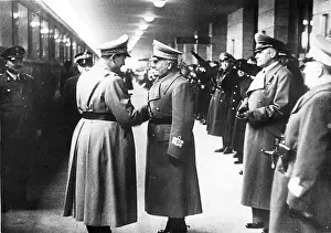 Benito Mussolini greets Hermann Goering