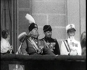 Reviewing: Benito Mussolini Reviewing Troops From A Balcony