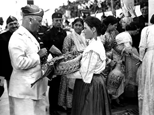 Townsfolk: BENITO MUSSOLINI, walks among townsfolk, ?