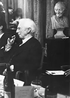 Classroger: Bertrand Russell with bust of Voltaire