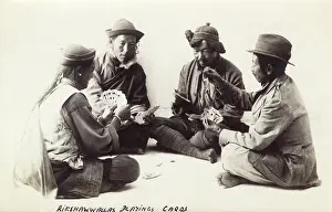 Bhutan: Four Bhutani Rickshaw Drivers playing cards