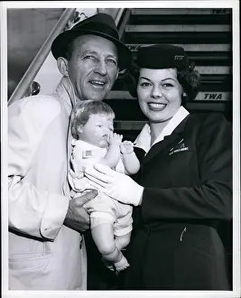 Reasonable: Bing Crosby with air hostess and doll