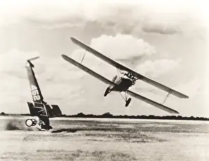 Mid Air: Biplane flying past crash on field